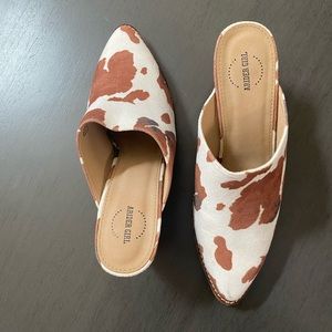 A Rider cow print heeled mule shoe, size 8.5.
